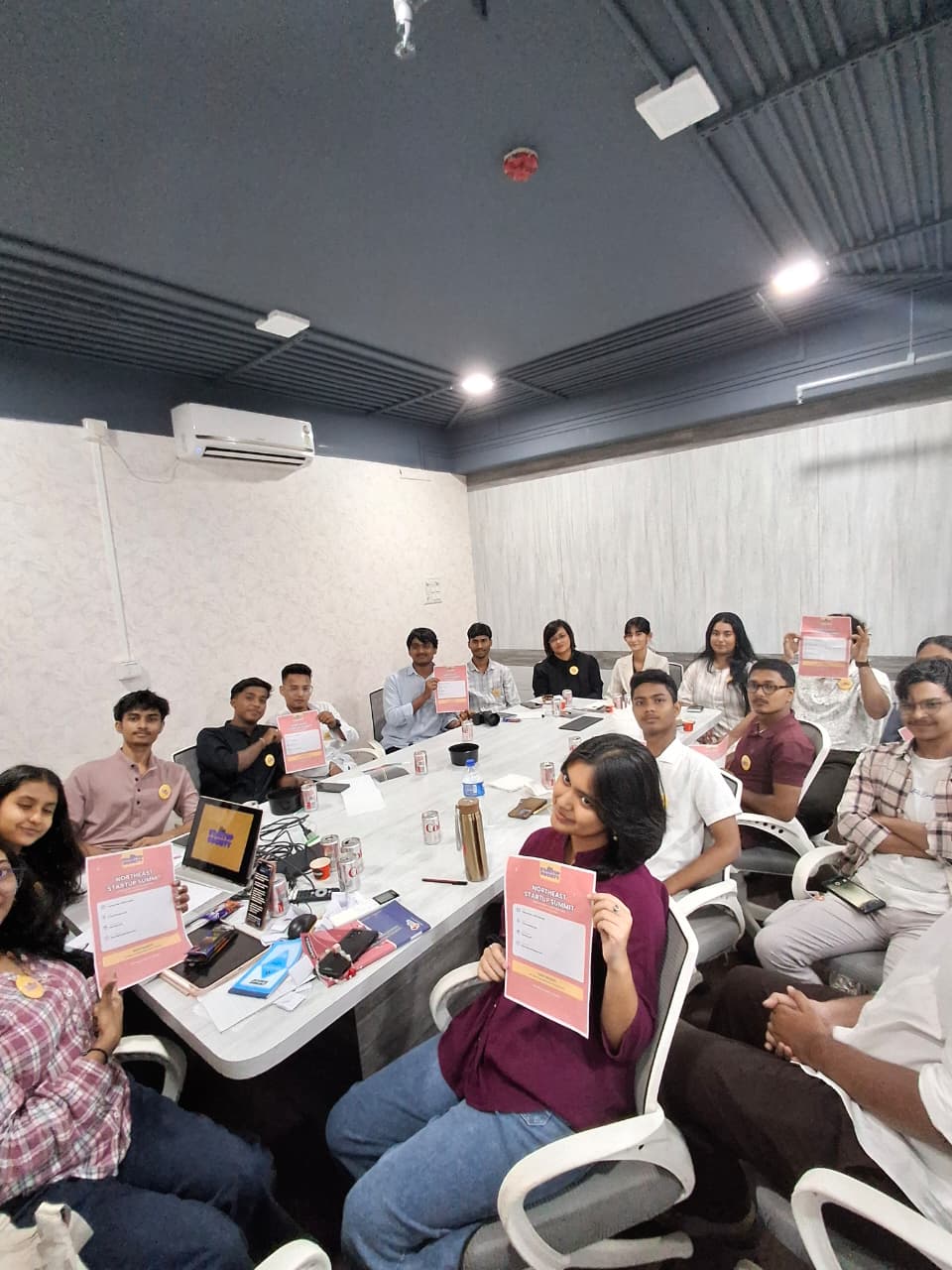 Workshop participants holding certificates